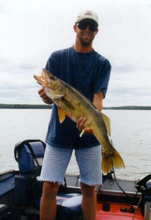 32.25" walleye - took a 10" jerk bait at high noon on rock reef in canada