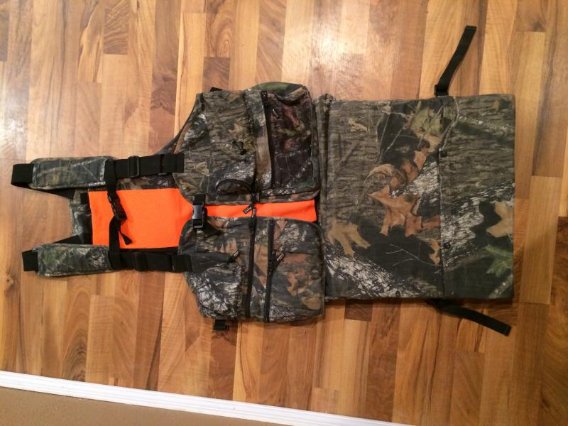 This is a LG Gander Mountain turkey vest in Mossy Oak Break Up. Has fully padded flip down seat. I upgraded a few years back and this has been sitting